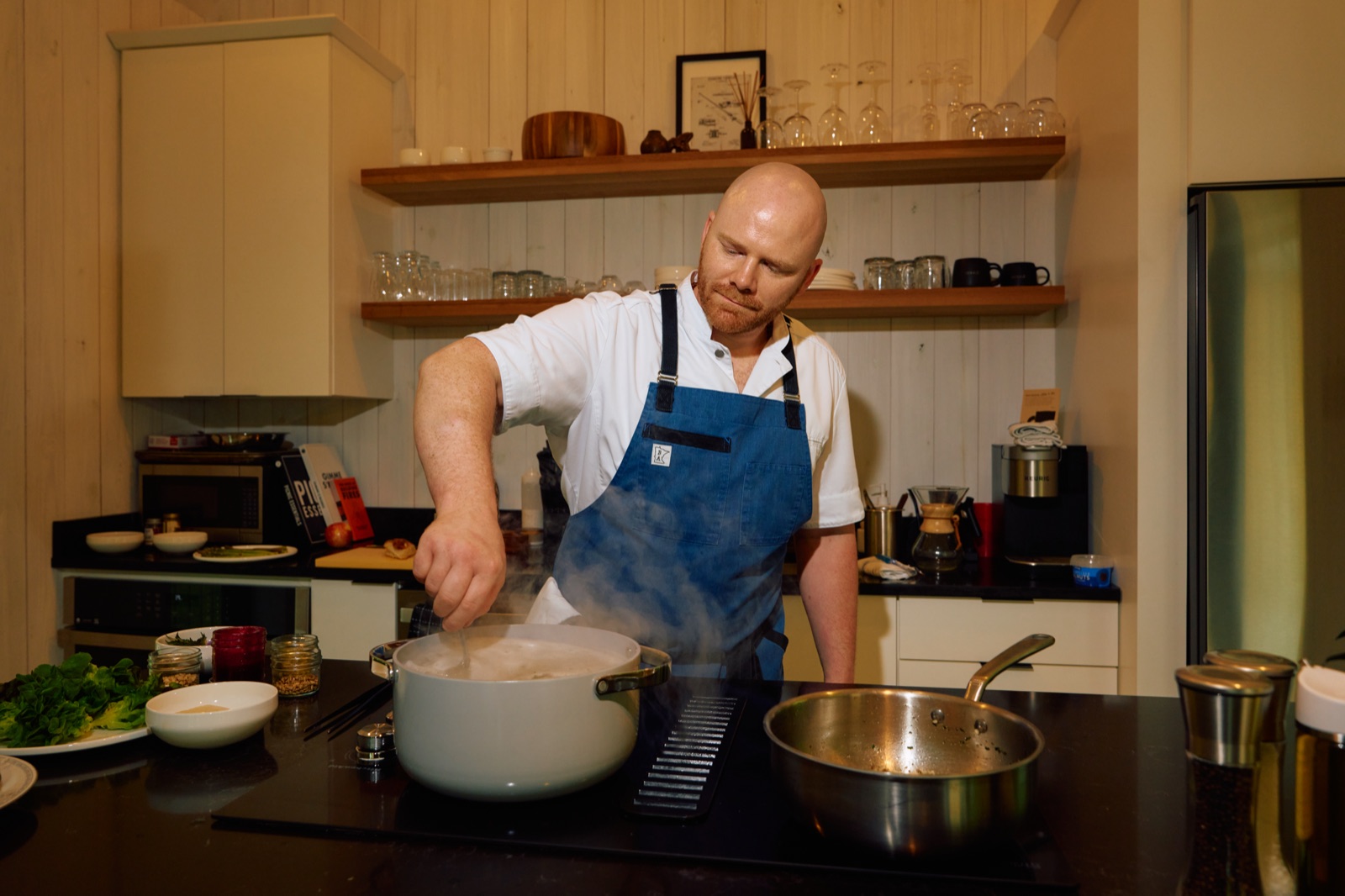 Chef John Lawrence cooking in a Hugga cabin kitchen