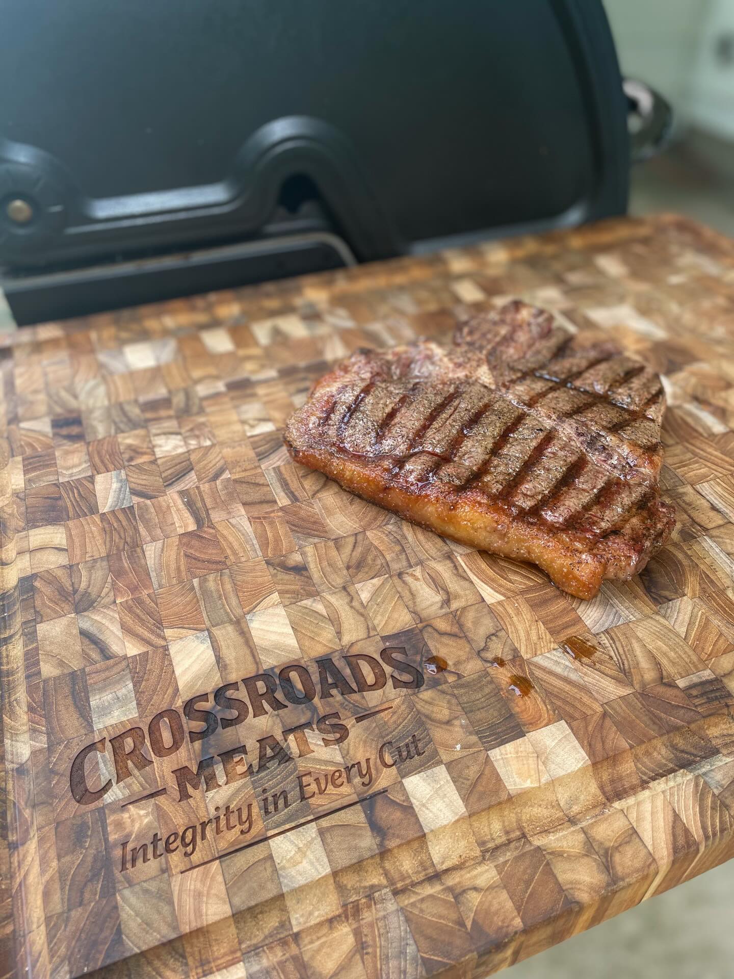 Grilled steak on the Crossroads Meats cutting board